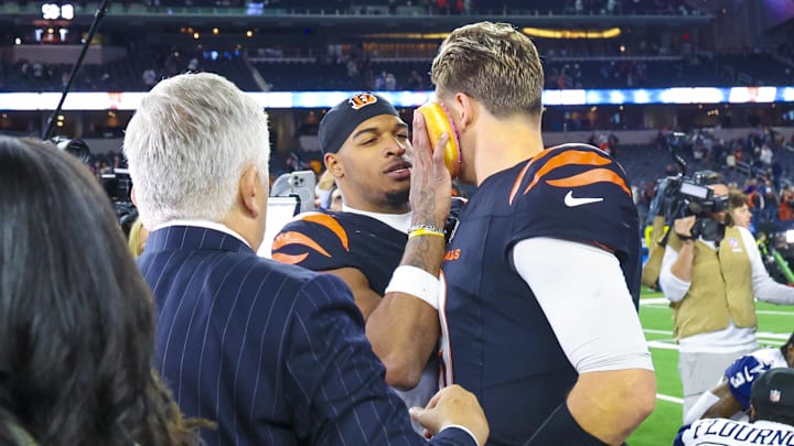 Dec 9, 2024; Arlington, Texas, USA; Cincinnati Bengals wide receiver Ja'Marr Chase (1) smashes a donut on the face of Cincinnati Bengals quarterback Joe Burrow (9) after the game against the Dallas Cowboys at AT&T Stadium. Mandatory Credit: Kevin Jairaj-Imagn Images Dec 9, 2024; Arlington, Texas, USA; Cincinnati Bengals wide receiver Ja'Marr Chase (1) smashes a donut on the face of Cincinnati Bengals quarterback Joe Burrow (9) after the game against the Dallas Cowboys at AT&T Stadium. Mandatory Credit: Kevin Jairaj-Imagn Images