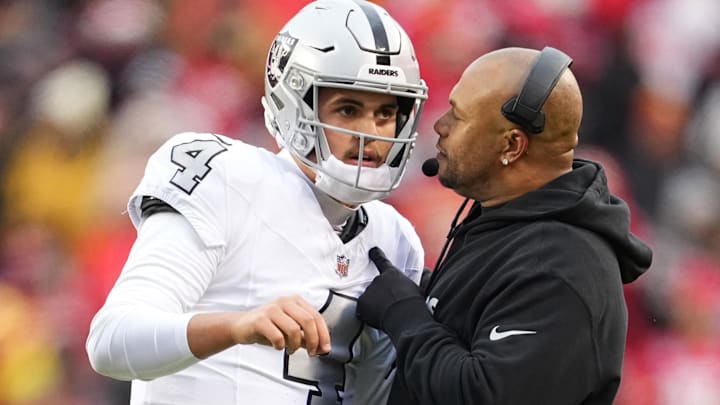 Dec 25, 2023; Kansas City, Missouri, USA; Las Vegas Raiders quarterback Aidan O'Connell (4) talks with head coach Antonio Pierce during the second half against the Las Vegas Raiders at GEHA Field at Arrowhead Stadium. Mandatory Credit: Jay Biggerstaff-USA TODAY Sports