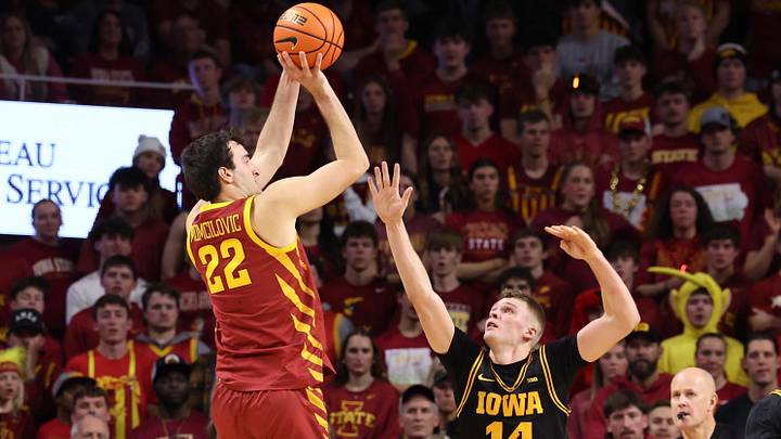 Dec 11, 2025; Ames, Iowa, USA; Iowa State Cyclones forward Milan Momcilovic (22) shoots over Iowa Hawkeyes guard Bennett Stirtz (14) during the second half at James H. Hilton Coliseum. Dec 11, 2025; Ames, Iowa, USA; Iowa State Cyclones forward Milan Momcilovic (22) shoots over Iowa Hawkeyes guard Bennett Stirtz (14) during the second half at James H. Hilton Coliseum.
