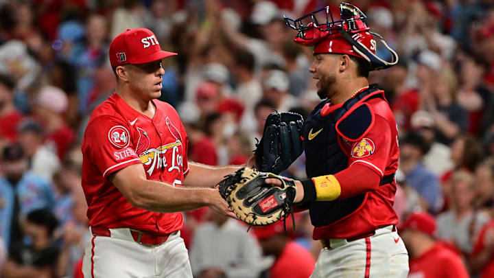 Aug 17, 2024; St. Louis, Missouri, USA;  St. Louis Cardinals relief pitcher Ryan Helsley (56) is congratulated by St. Louis Cardinals catcher Willson Contreras (40) in the ninth inning after the St. Louis Cardinals defeated the Los Angeles Dodgers at Busch Stadium. Mandatory Credit: Tim Vizer-Imagn Images