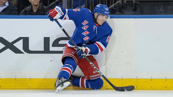 Sep 23, 2025; New York, New York, USA; New York Rangers left wing Brett Berard (65) plays the puck during the first period of a preseason game against the Boston Bruins at Madison Square Garden. Mandatory Credit: Vincent Carchietta-Imagn Images