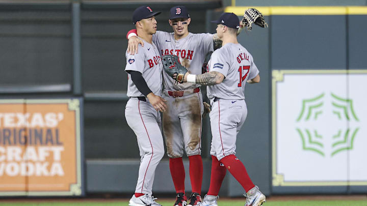 Aug 20, 2024; Houston, Texas, USA; Boston Red Sox center fielder Jarren Duran (16) celebrates with left fielder Rob Refsnyder (30) and right fielder Tyler O'Neill (17) after the game against the Houston Astros at Minute Maid Park. Mandatory Credit: Troy Taormina-Imagn Images