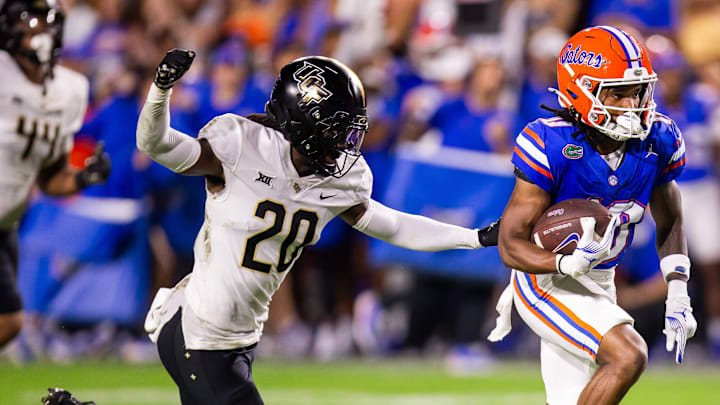 Eagles rookie CB Mac McWilliams tries to strip Florida Gators wide receiver Tank Hawkins (10). Eagles rookie CB Mac McWilliams tries to strip Florida Gators wide receiver Tank Hawkins (10).