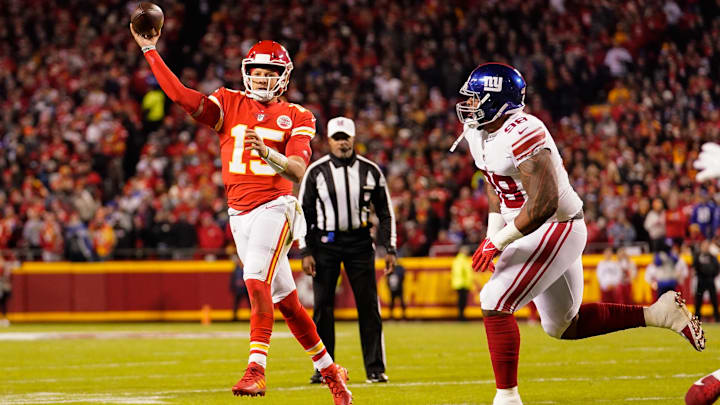 Nov 1, 2021; Kansas City, Missouri, USA; Kansas City Chiefs quarterback Patrick Mahomes (15) throws a pass as New York Giants nose tackle Austin Johnson (98) defends during the first half at GEHA Field at Arrowhead Stadium.  