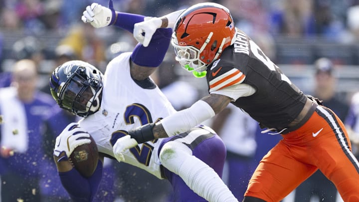 Oct 27, 2024; Cleveland, Ohio, USA; Cleveland Browns safety Grant Delpit (9) tackles Baltimore Ravens running back Derrick Henry (22) during the first quarter at Huntington Bank Field. Mandatory Credit: Scott Galvin-Imagn Images