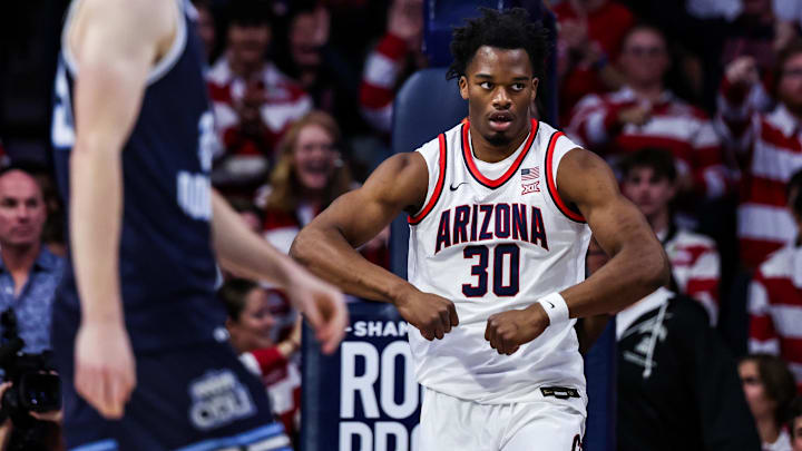 Nov 9, 2024; Tucson, Arizona, USA;  Arizona Wildcats forward Tobe Awaka (30) celebrates his dunk during the first half against the Old Dominion Monarchs at McKale Center.