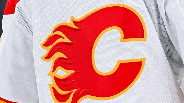 Dec 12, 2022; Montreal, Quebec, CAN; View of a Calgary Flames logo on a jersey worn by the member of the team during the second period at Bell Centre. Mandatory Credit: David Kirouac-Imagn Images