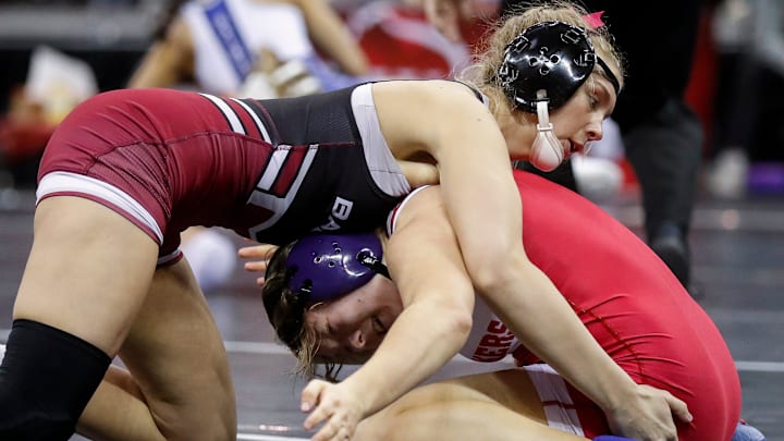 Badger High School's Carley Ceshker wrestles against Monroe High School's Althea Eckdhal in a girls 138-pound semifinal match during the WIAA state individual wrestling tournament on February 28, 2025.