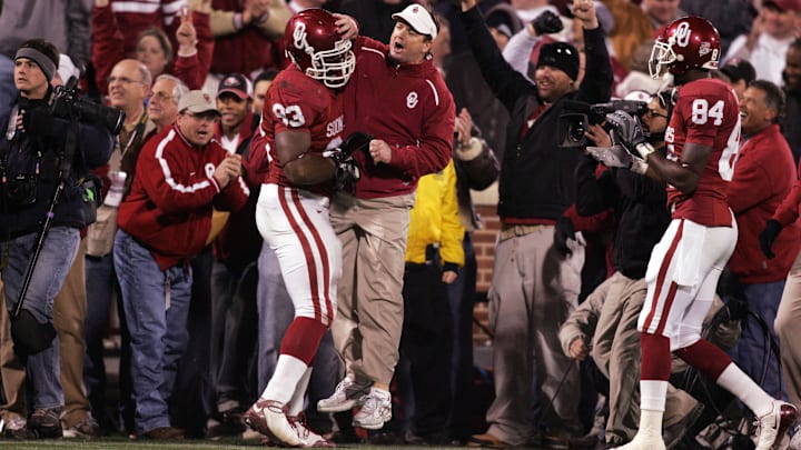 Oklahoma Sooners head coach Bob Stoops celebrates an interception with defensive tackle Gerald McCoy (93) during the game against the Texas Tech Red Raiders at Gaylord Family Oklahoma Memorial Stadium in Norman in 2008. Oklahoma Sooners head coach Bob Stoops celebrates an interception with defensive tackle Gerald McCoy (93) during the game against the Texas Tech Red Raiders at Gaylord Family Oklahoma Memorial Stadium in Norman in 2008.