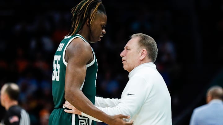 Michigan State head coach Tom Izzo talks to forward Coen Carr (55) during the second half of the