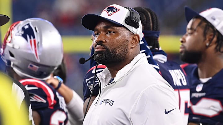 August 8, 2024; Foxborough, MA, USA;  New England Patriots head coach Jerod Mayo watches the video boards after challenging a call on the field during the second half against the Carolina Panthers at Gillette Stadium. Mandatory Credit: Eric Canha-USA TODAY Sports