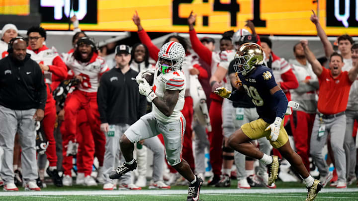 Ohio State Buckeyes wide receiver Jeremiah Smith (4) makes a catch against Notre Dame Fighting Irish cornerback Christian Gray (29) in the fourth quarter during the College Football Playoff National Championship at Mercedes-Benz Stadium in Atlanta on January 20, 2025. Ohio State Buckeyes wide receiver Jeremiah Smith (4) makes a catch against Notre Dame Fighting Irish cornerback Christian Gray (29) in the fourth quarter during the College Football Playoff National Championship at Mercedes-Benz Stadium in Atlanta on January 20, 2025.