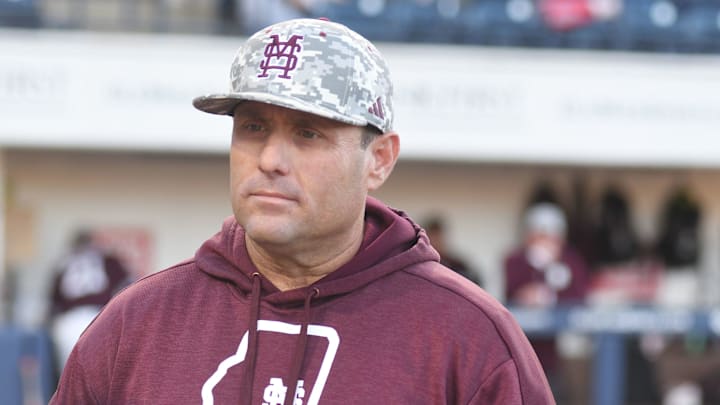 Mississippi State head coach Chris Lemonis listens to the ground rules before the game against Ole Miss at Swayze Field in Oxford, Miss., on Friday, Apr. 12, 2024.