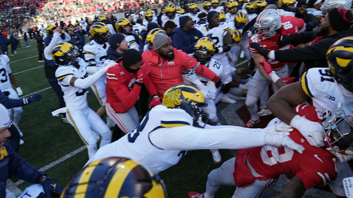 Michigan and Ohio State players brawl after the Wolverines upset the Buckeyes 13-10 on Nov. 30, 2024. Michigan and Ohio State players brawl after the Wolverines upset the Buckeyes 13-10 on Nov. 30, 2024.