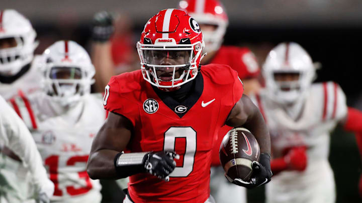 Georgia running back Roderick Robinson II (0) breaks away for a big gain during the second half of a NCAA college football game against Ole Miss in Athens, Ga., on Saturday, Nov. 11, 2023. Georgia won 52-17.
