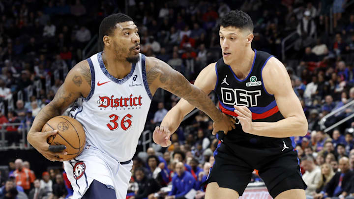 Mar 13, 2025; Detroit, Michigan, USA;  Washington Wizards guard Marcus Smart (36) dribbles defended by Detroit Pistons forward Simone Fontecchio (19) in the first half at Little Caesars Arena. Mandatory Credit: Rick Osentoski-Imagn Images