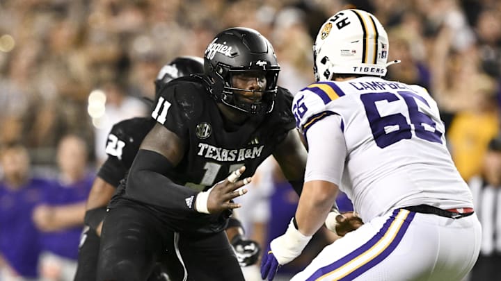 Texas A&M Aggies defensive lineman Nic Scourton defends in coverage against LSU Tigers offensive tackle Will Campbell. Texas A&M Aggies defensive lineman Nic Scourton defends in coverage against LSU Tigers offensive tackle Will Campbell.