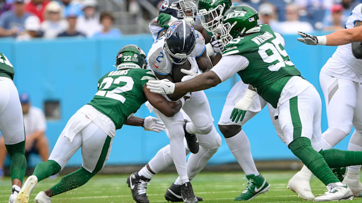 Sep 15, 2024; Nashville, Tennessee, USA;  New York Jets safety Tony Adams (22) and defensive end Will McDonald IV (99) tackles Tennessee Titans running back Tyjae Spears (2) during the first half at Nissan Stadium. 