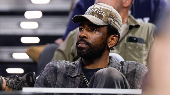 Mar 29, 2026; Fort Worth, TX, USA; Dallas Mavericks guard Kyrie Irving looks on from the stands during the second half of the game between the UConn Huskies and Notre Dame Fighting Irish at Dickies Arena. Mandatory Credit: Chris Jones-Imagn Images Mar 29, 2026; Fort Worth, TX, USA; Dallas Mavericks guard Kyrie Irving looks on from the stands during the second half of the game between the UConn Huskies and Notre Dame Fighting Irish at Dickies Arena. Mandatory Credit: Chris Jones-Imagn Images