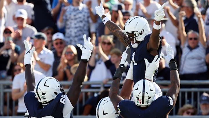 Penn State football wide receiver Kyron Hudson (1) celebrates with teammates after scoring a touchdown during the second quarter against the Nevada Wolf Pack