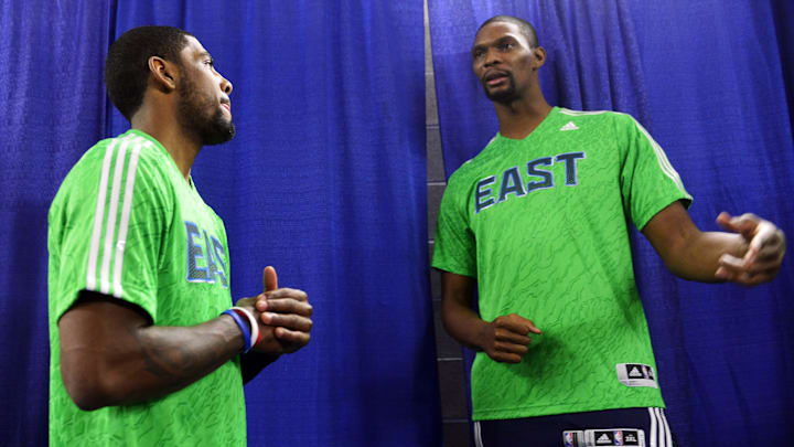 Feb 16, 2014; New Orleans, LA, USA; Eastern Conference forward Chris Bosh (1) of the Miami Heat talks with Eastern Conference Kyrie Irving guard (2) of the Cleveland Cavaliers before the 2014 NBA All-Star Game at the Smoothie King Center. Mandatory Credit: Bob Donnan-Imagn Images
