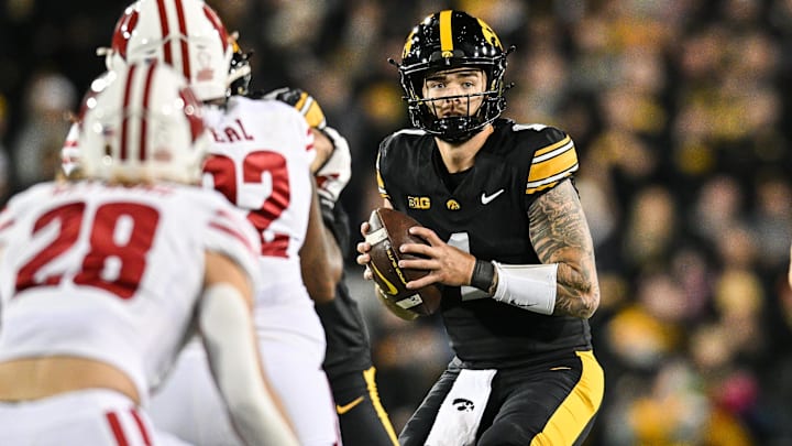 Nov 2, 2024; Iowa City, Iowa, USA; Iowa Hawkeyes quarterback Brendan Sullivan (1) controls the offense against the Wisconsin Badgers during the second quarter at Kinnick Stadium. Mandatory Credit: Jeffrey Becker-Imagn Images