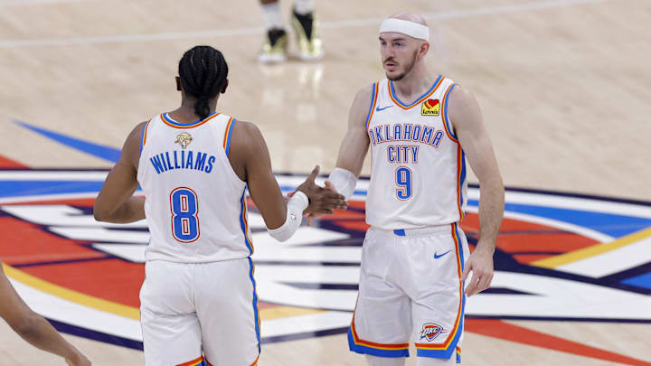 Oklahoma City Thunder forward Jalen Williams (8) and guard Alex Caruso (9) celebrate during the second quarter against the Indiana Pacers in Game 5 of the 2025 NBA Finals at Paycom Center. Oklahoma City Thunder forward Jalen Williams (8) and guard Alex Caruso (9) celebrate during the second quarter against the Indiana Pacers in Game 5 of the 2025 NBA Finals at Paycom Center.
