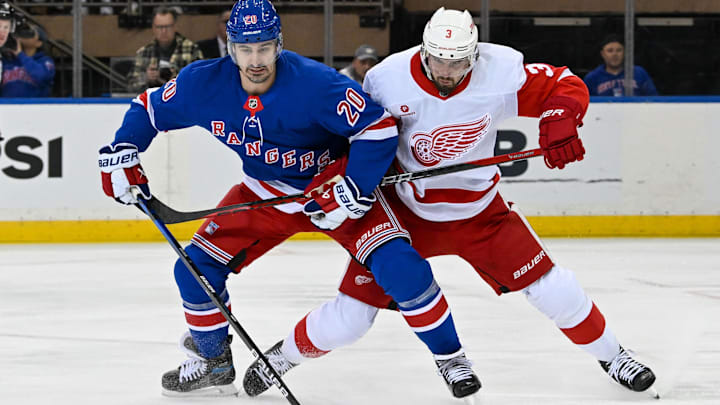 Oct 14, 2024; New York, New York, USA;  Detroit Red Wings defenseman Justin Holl (3) defends against New York Rangers left wing Chris Kreider (20) during the first period at Madison Square Garden. Mandatory Credit: Dennis Schneidler-Imagn Images