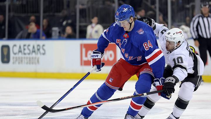 Mar 16, 2026; New York, New York, USA; New York Rangers center Adam Edstrom (84) plays the puck against Los Angeles Kings left wing Artemi Panarin (10) during the second period at Madison Square Garden. Mandatory Credit: Brad Penner-Imagn Images