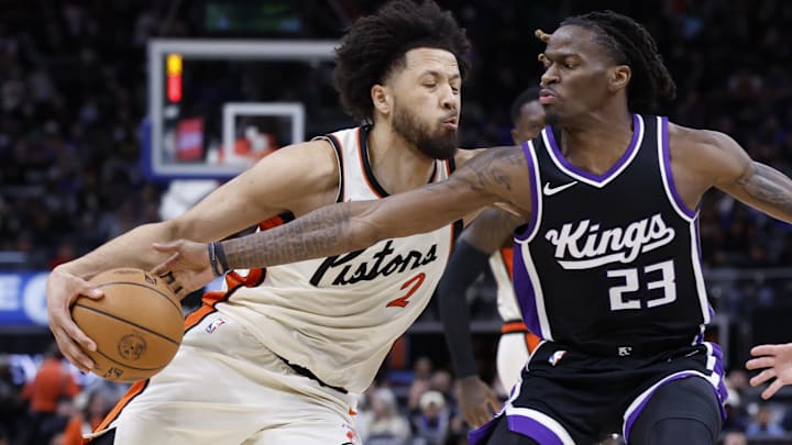 Apr 7, 2025; Detroit, Michigan, USA;  Sacramento Kings guard Keon Ellis (23) knocks the ball away from Detroit Pistons guard Cade Cunningham (2) in the second half at Little Caesars Arena. Apr 7, 2025; Detroit, Michigan, USA;  Sacramento Kings guard Keon Ellis (23) knocks the ball away from Detroit Pistons guard Cade Cunningham (2) in the second half at Little Caesars Arena.