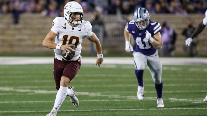Arizona State Sun Devils quarterback Sam Leavitt (10) runs away from Kansas State Wildcats linebacker Austin Moore (41) during the first quarter at Bill Snyder Family Football Stadium. Arizona State Sun Devils quarterback Sam Leavitt (10) runs away from Kansas State Wildcats linebacker Austin Moore (41) during the first quarter at Bill Snyder Family Football Stadium.