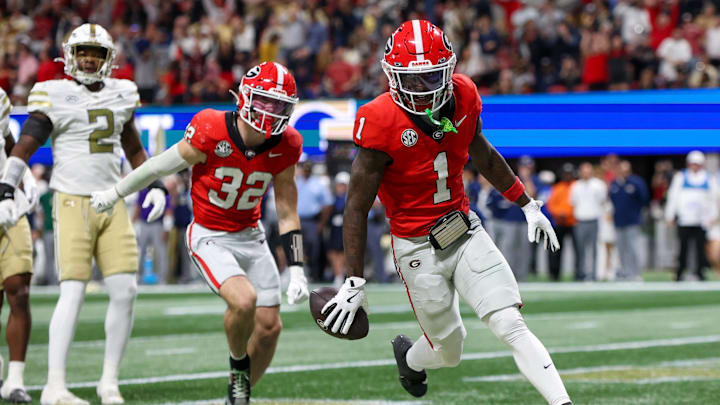 Nov 28, 2025; Atlanta, Georgia, USA; Georgia Bulldogs wide receiver Zachariah Branch (1) celebrates after a touchdown catch against the Georgia Tech Yellow Jackets in the second quarter at Mercedes-Benz Stadium. Mandatory Credit: Brett Davis-Imagn Images
