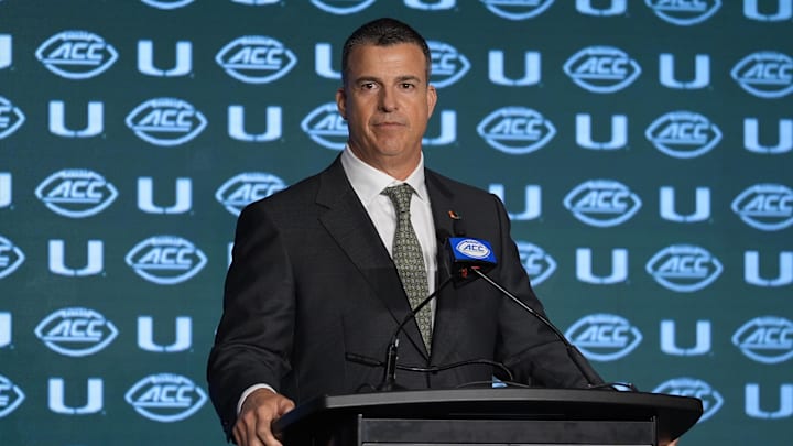 Jul 24, 2024; Charlotte, NC, USA;  Miami Hurricanes head coach Mario Cristobal speaks to the media during the ACC Kickoff at Hilton Charlotte Uptown. Mandatory Credit: Jim Dedmon-Imagn Images
