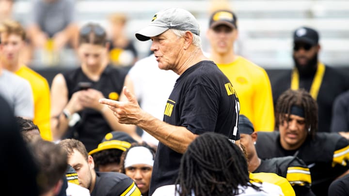 Aug 9, 2025; Iowa head coach Kirk Ferentz talks with players during the Hawkeyes Kids Day NCAA football open practice at Kinnick Stadium in Iowa City, Iowa. Mandatory Credit: Joseph Cress for the Des Moines Register