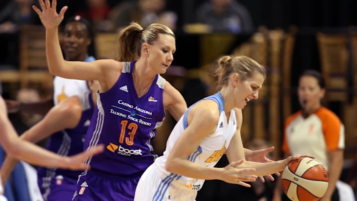 Sep 12, 2014; Chicago, IL, USA; Chicago Sky guard Allie Quigley (right) loses the ball while defended by Phoenix Mercury forward Penny Taylor (13) during the first quarter in game three of the 2014 WNBA Finals at UIC Pavilion. Mandatory Credit: Jerry Lai-Imagn Images