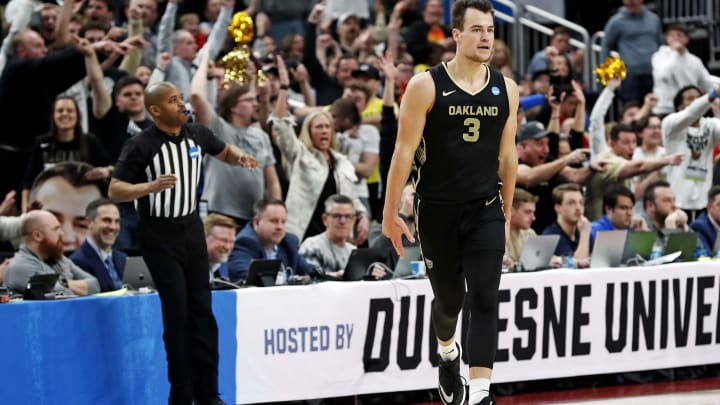 Mar 23, 2024; Pittsburgh, PA, USA; Oakland Golden Grizzlies guard Jack Gohlke (3) celebrates after making a three pointer during the second half of the game against the North Carolina State Wolfpack in the second round of the 2024 NCAA Tournament at PPG Paints Arena. Mandatory Credit: Charles LeClaire-USA TODAY Sports Mar 23, 2024; Pittsburgh, PA, USA; Oakland Golden Grizzlies guard Jack Gohlke (3) celebrates after making a three pointer during the second half of the game against the North Carolina State Wolfpack in the second round of the 2024 NCAA Tournament at PPG Paints Arena. Mandatory Credit: Charles LeClaire-USA TODAY Sports