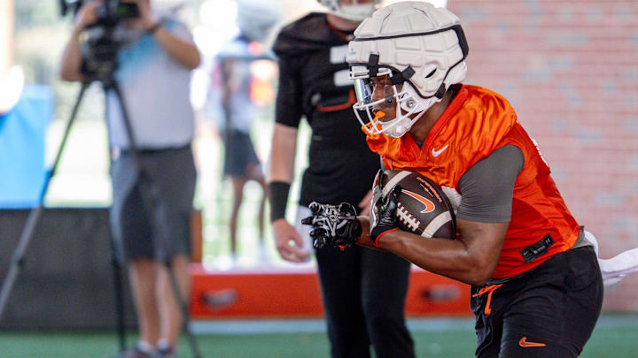 Trent Howland (24) runs drills during an Oklahoma State football practice in Stillwater, Okla., on Wednesday, July 31, 2024.