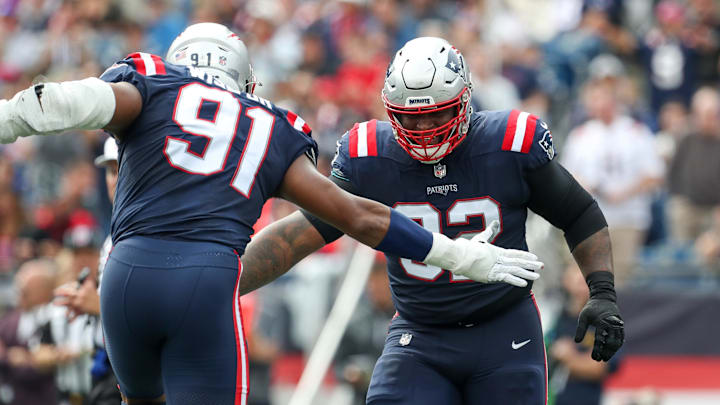 Sep 25, 2022; Foxborough, Massachusetts, USA; New England Patriots nose tackle Davon Godchaux (92) reacts during the first half against the Baltimore Ravens at Gillette Stadium. Mandatory Credit: Paul Rutherford-Imagn Images