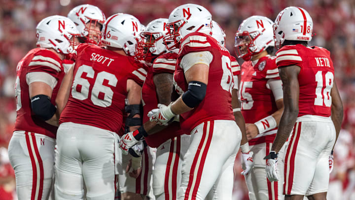 The Nebraska Cornhuskers huddle. The Nebraska Cornhuskers huddle.
