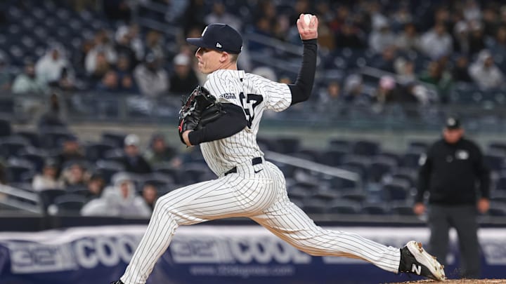 Apr 23, 2024; Bronx, New York, USA; New York Yankees relief pitcher Ron Marinaccio (97) delivers a pitch during the sixth inning against the Oakland Athletics at Yankee Stadium. Mandatory Credit: Vincent Carchietta-Imagn Images