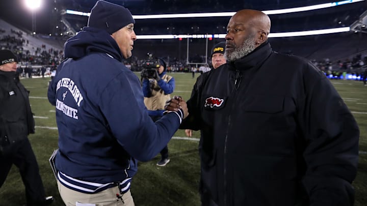 Penn State Nittany Lions head coach James Franklin (left) shakes hands at midfield with Maryland Terrapins head coach Michael Locksley (right) following a game at Beaver Stadium. 