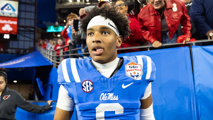 Jan 8, 2026; Glendale, AZ, USA; Detailed view of the jersey of Mississippi Rebels quarterback Trinidad Chambliss (6) against the Miami Hurricanes during the 2026 Fiesta Bowl and semifinal game of the College Football Playoff at State Farm Stadium. Mandatory Credit: Mark J. Rebilas-Imagn Images Jan 8, 2026; Glendale, AZ, USA; Detailed view of the jersey of Mississippi Rebels quarterback Trinidad Chambliss (6) against the Miami Hurricanes during the 2026 Fiesta Bowl and semifinal game of the College Football Playoff at State Farm Stadium. Mandatory Credit: Mark J. Rebilas-Imagn Images