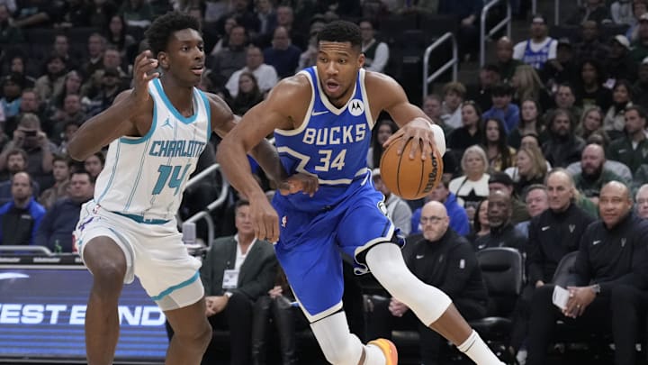 Nov 23, 2024; Milwaukee, Wisconsin, USA;  Milwaukee Bucks forward Giannis Antetokounmpo (34) drives to the basket against Charlotte Hornets forward Moussa Diabate (14) in the first half at Fiserv Forum. Mandatory Credit: Michael McLoone-Imagn Images