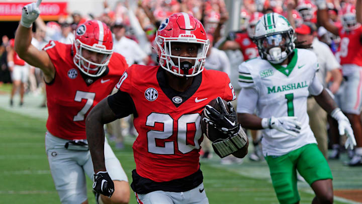 Georgia running back Dwight Phillips Jr (20) drives in for a touchdown during the first half of a NCAA college football game against Marshall in Athens, Ga., on Saturday, August. 30, 2025.