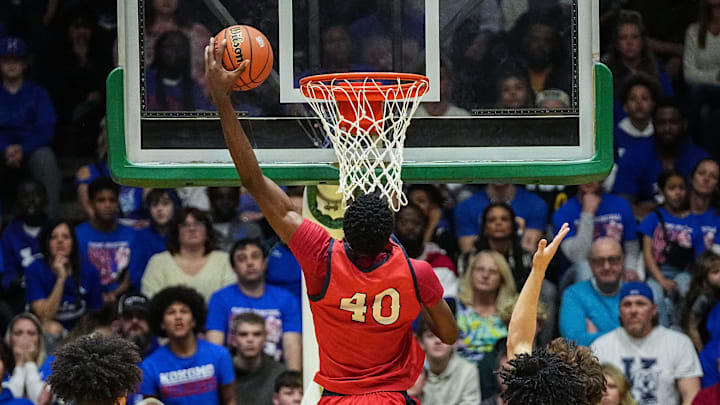 Kokomo Wildkats center Flory Bidunga (40) goes in for a dunk Saturday, March 9, 2024