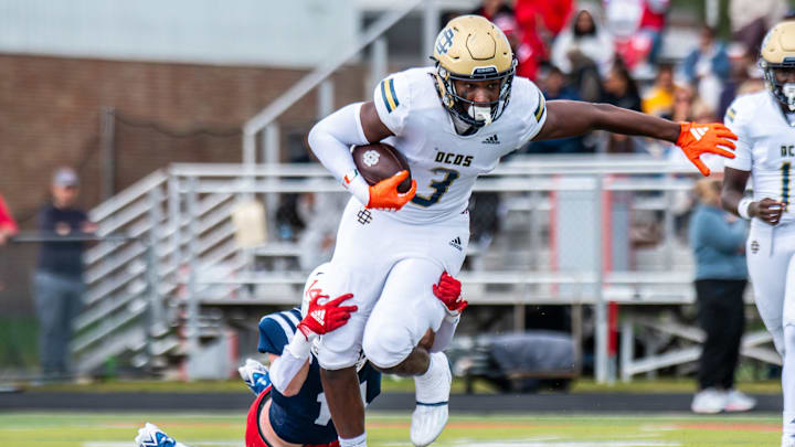 Detroit Country Day's Anthony Cartwright rushes during a football game on Saturday, Sept. 6, 2025, at Joseph P. Healey Field.