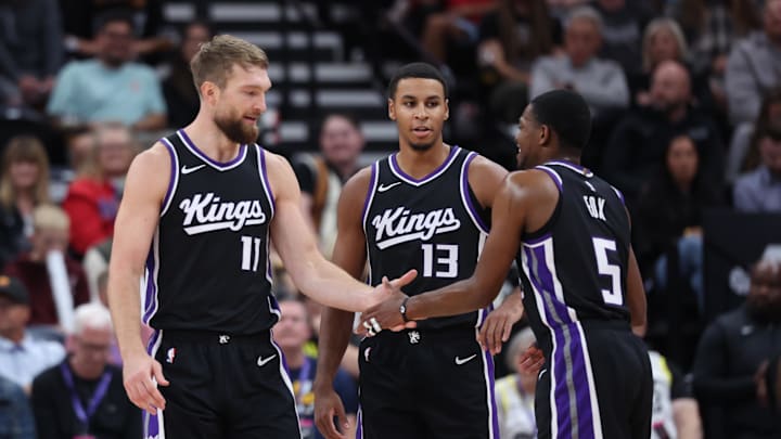 Oct 15, 2024; Salt Lake City, Utah, USA; Sacramento Kings forward Domantas Sabonis (11), forward Keegan Murray (13) and guard De'Aaron Fox (5) react to a play against the Utah Jazz during the second quarter at Delta Center. Mandatory Credit: Rob Gray-Imagn Images