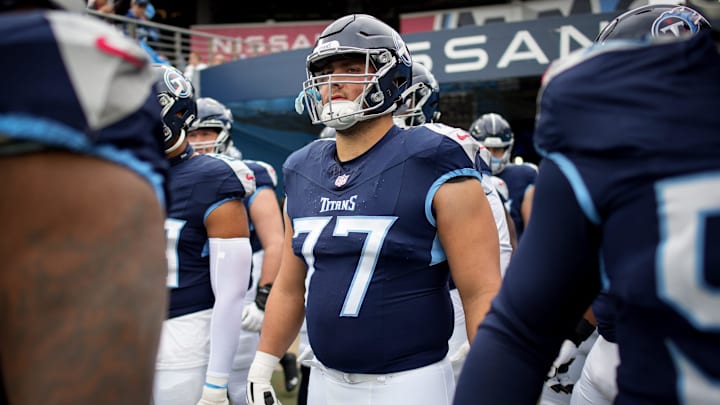 Tennessee Titans offensive tackle Peter Skoronski (77) heads out for warm ups before a game against the Carolina Panthers at Nissan Stadium in Nashville, Tenn., Sunday, Nov. 26, 2023. Tennessee Titans offensive tackle Peter Skoronski (77) heads out for warm ups before a game against the Carolina Panthers at Nissan Stadium in Nashville, Tenn., Sunday, Nov. 26, 2023.