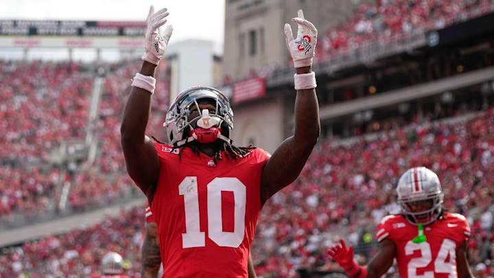 Aug 31, 2024; Columbus, OH, USA; Ohio State Buckeyes cornerback Denzel Burke (10) celebrates an interception during the first half of the NCAA football game against the Akron Zips at Ohio Stadium. Aug 31, 2024; Columbus, OH, USA; Ohio State Buckeyes cornerback Denzel Burke (10) celebrates an interception during the first half of the NCAA football game against the Akron Zips at Ohio Stadium.