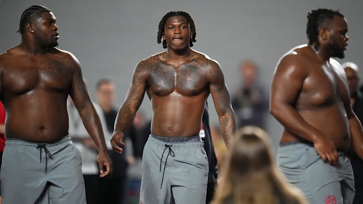 From left, Ohio State Buckeyes defensive tackle Tywone Malone, linebacker Arvell Reese and defensive tackle Kayden McDonald work out during Pro Day for NFL scouts at the Woody Hayes Athletics Center on March 25, 2026.